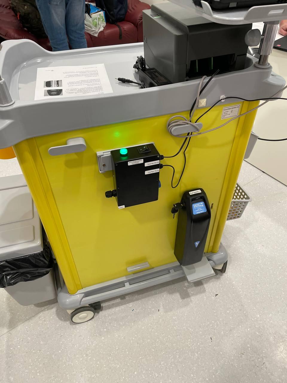 Smart-battery hardware installed on a connected service cart